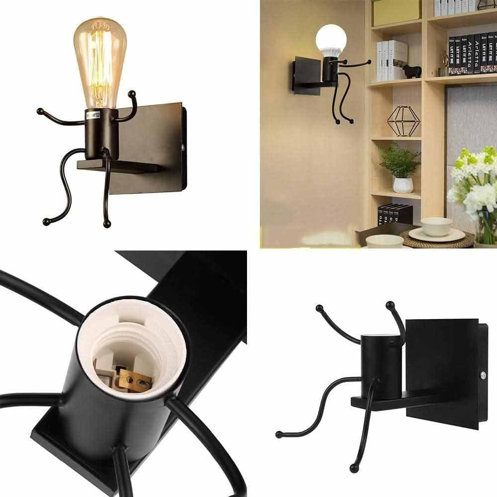 Universo - Applique da Parete Decorativo a Forma di Omino - Lampada da Muro in Metallo con Attacco E27 per Arredo Casa Soggiorno Ingresso (Omino Seduto Nero)