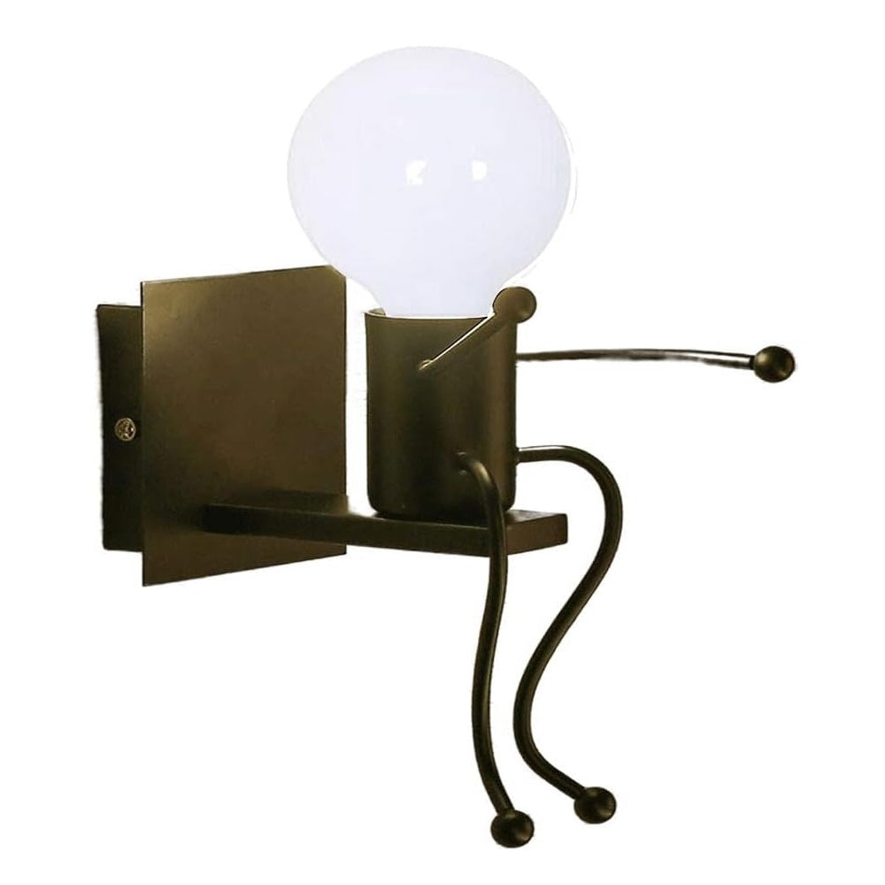 Universo - Applique da Parete Decorativo a Forma di Omino - Lampada da Muro in Metallo con Attacco E27 per Arredo Casa Soggiorno Ingresso (Omino Seduto Nero)
